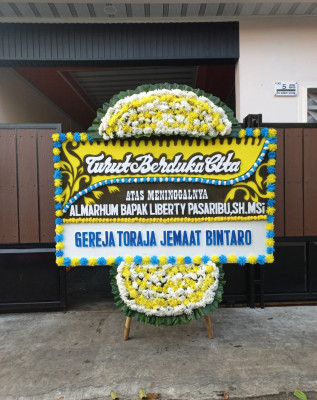 Papan Bunga Duka di Sinak